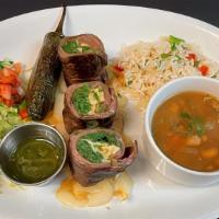 Mexican Pinwheel Steak · Skirt steak rolled with chimichurri, spinach and cotija cheese, charbroiled, jalapeno toreado.