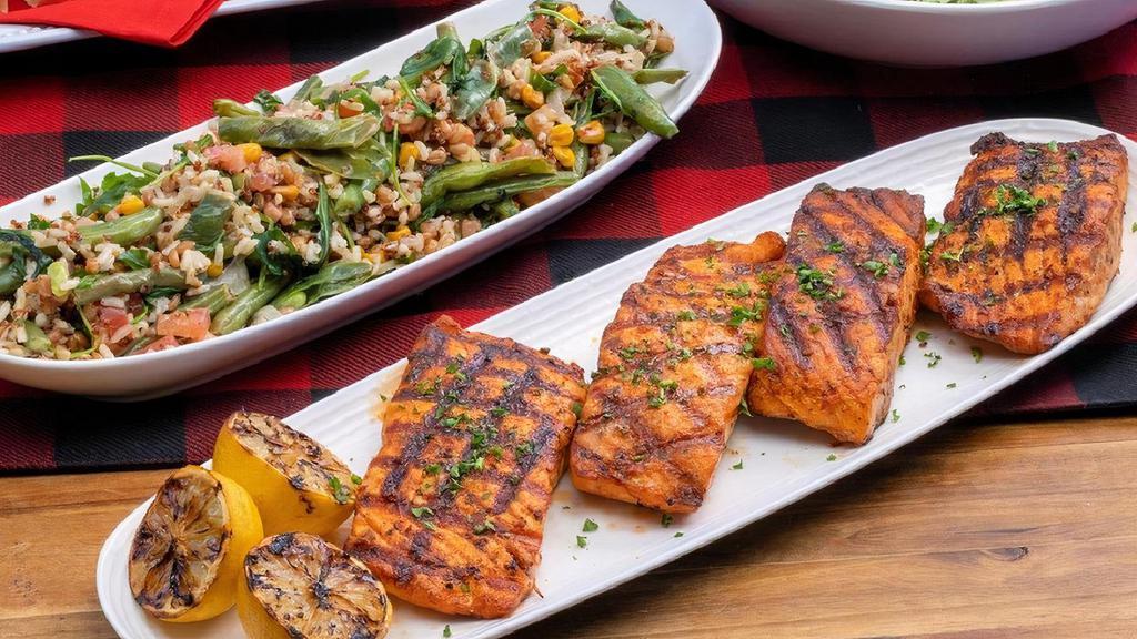 Chargrilled Salmon ~ Party Pack · four chargrilled salmon filets · chipotle butter · choice of four individual sides · family size House Salad · six dinner rolls with butter · feeds a party of 4