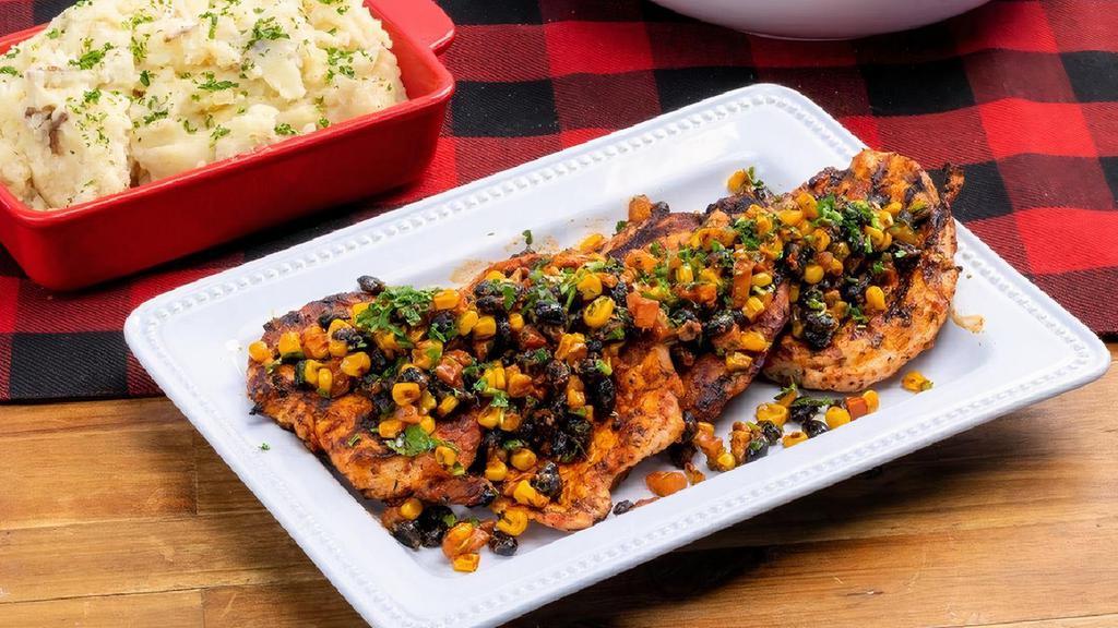 Spicy Chipotle Chicken ~ Party Pack · four blackened chicken breasts · southwest pico de gallo · choice of four individual sides · family size House Salad · six dinner rolls with butter · feeds a party of 4