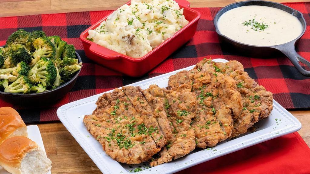 Chicken Fried Steak ~ Party Pack · four fried steaks · jalapeño gravy · choice of four individual sides · family size House Salad · six dinner rolls with butter · feeds a party of 4