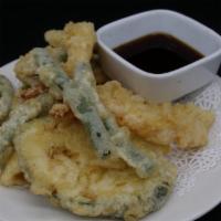 Shrimp And Vegetable Tempura · 3 pieces of shrimp strips battered and light fried with vegetables served with tempura sauce.