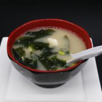 Miso Soup · Japanese miso broth with seaweed, tofu and scallions.