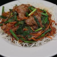 Mongolian Beef · Sliced beef stir fried with carrots and green onions cooked deliciously in a garlic sauce. S...