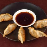 Gyoza  (3Pd) · Pan-seared Japanese pot-sticker dumplings filled with shredded pork and vegetables. Served w...