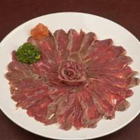Bf Sashimi · 4oz Center Cut Certified Angus Beef filet mignon, seared and thinly sliced. Served with our ...