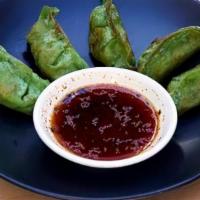 Gyoza Vegatable · Pan-seared Japanese pot-sticker dumplings filled with nine different kinds of vegetables wra...