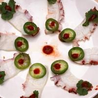 Razor Octopus · Thinly sliced Octopus topped with cilantro, freshly sliced jalapenos and sriracha sauce fini...