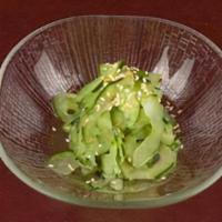 Cucmbr Sunomono · Cucumber in a sweet vinaigrette dressing topped with sesame seeds.