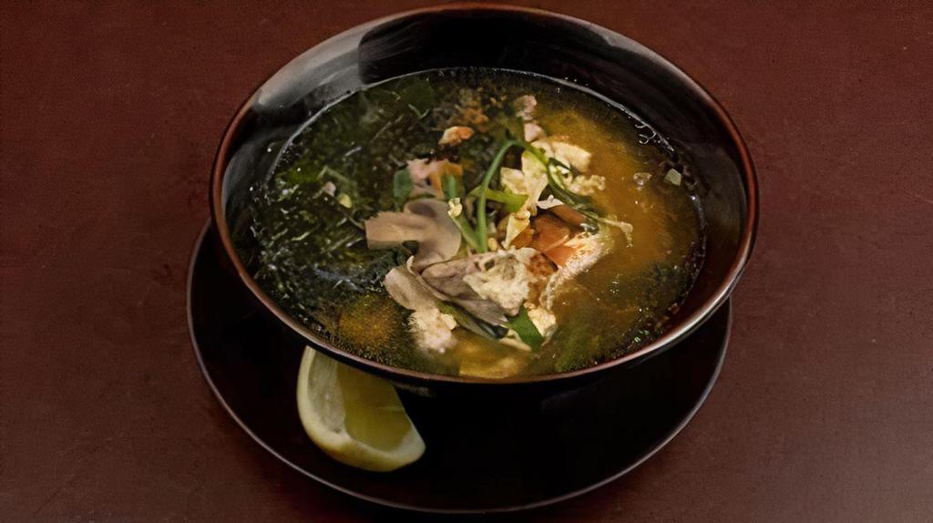 Tori Zosui · Chicken, rice, wakame seaweed, green onions, egg drop and white mushrooms in a light chicken broth.