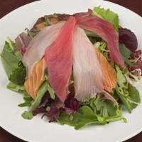Sashimi Salad · Spring mix with tuna, salmon and yellowtail sashimi served with a spicy and savory dressing.
