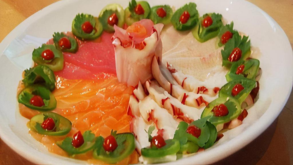 Razor Sashimi Sampler · Assortment of thinly sliced sashimi including tuna, salmon, yellowtail and octopus topped with cilantro, jalapeno, Sriracha and Yuzu sauce.