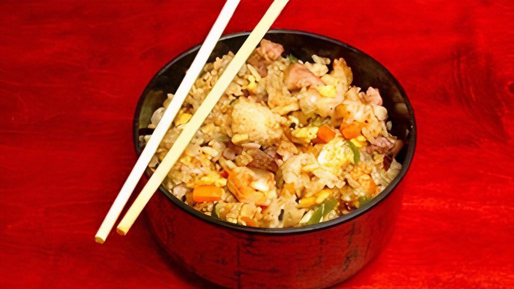Combo Yakimeshi · Teppan-fried Japanese rice, Beef, chicken and shrimp, eggs, carrots, zucchini, peppers, onions.