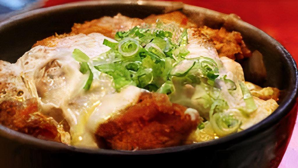 Katsu Don · Panko-breaded pork tenderloin, egg, onion and shiitake mushrooms served over rice. Drizzled with a sweet broth, topped with kamaboko and nori.