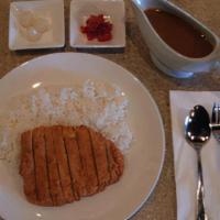 Katsu Curry · Japanese curry rice with panko-breaded pork tenderloin.