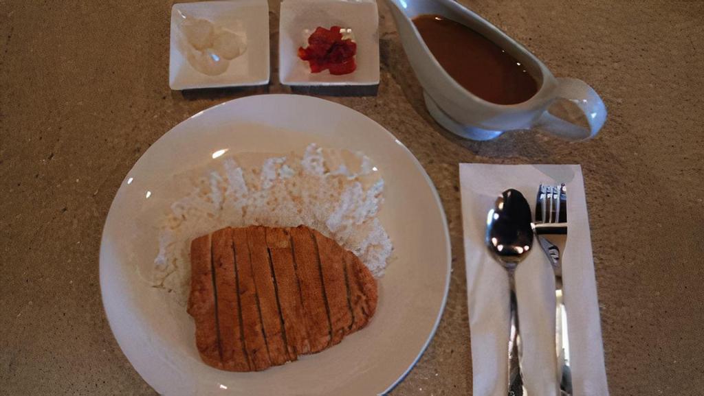 Katsu Curry · Japanese curry rice with panko-breaded pork tenderloin.