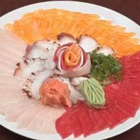 Sashimi Sampler Thin Sliced · Assortment of sashimi: Tuna, salmon, yellowtail and octopus.
