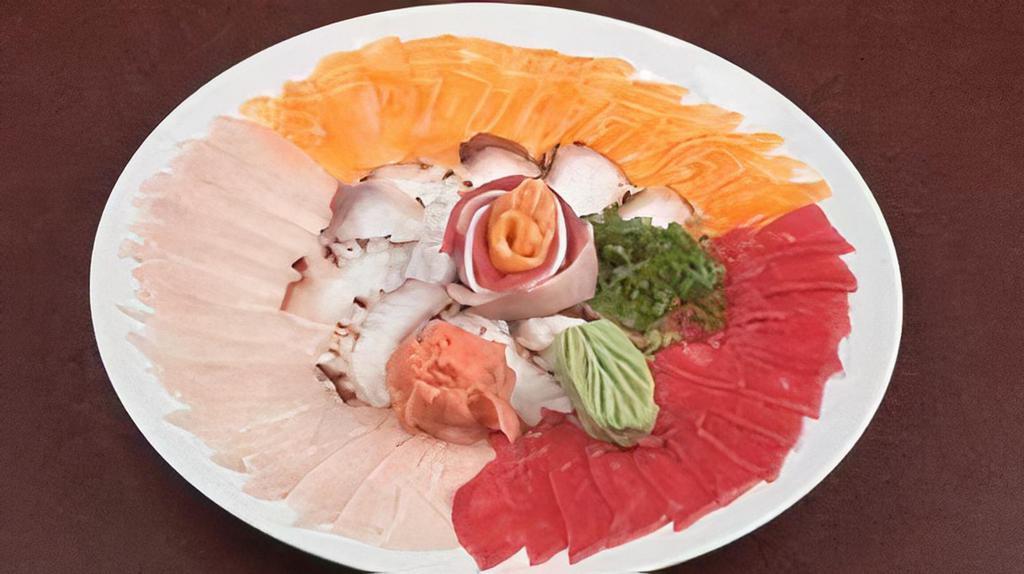 Sashimi Sampler Thin Sliced · Assortment of sashimi: Tuna, salmon, yellowtail and octopus.