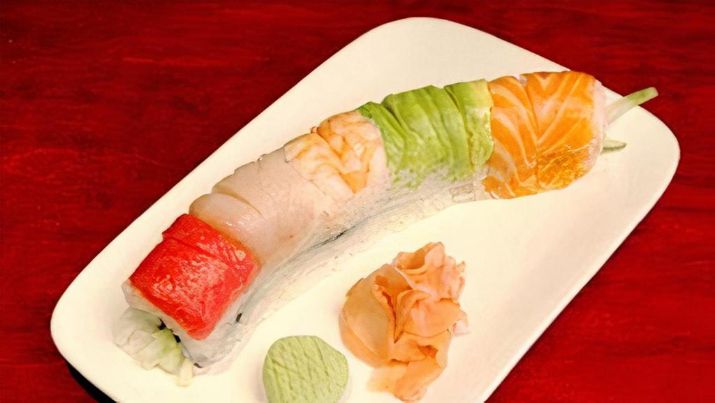 Rainbow Roll · Kanikama, avocado, cucumber, wrapped with yellowtail, avocado, tuna, shrimp, salmon, uramaki style