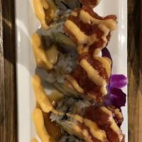 Amazon Roll · Shrimp tempura, avocado topped w/ salmon, spicy tuna, eel sauce & spicy mayo.