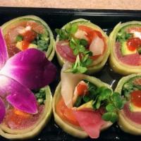 Yogi Bear Roll · Salmon, tuna, white fish, shrimp, jalapenos, radish sprouts avocado wrapped in cucumber serv...