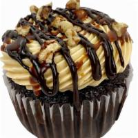 Chocolate Turtle · A chocolate cupcake with intense caramel buttercream and drizzled with chocolate, caramel, a...