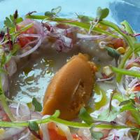 Ceviche Peruano · Fish and shrimp marinated in leche de tigre, made with lemon, serrano, cilantro and celery. ...