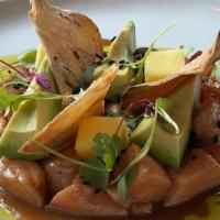 Tartar De Salmon · Small pieces of fresh salmon, mango and avocado marinated in lemon juice, soy sauce and bals...