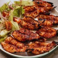 Camarones Zarandeados · Grilled shrimp served with mixed lettuce salad and white rice.