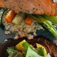 Salmon Al Tamarindo · Grilled salmon over tamarind sauce, and Mango pico de Gallo, with white rice and sautéed veg...