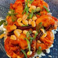 Bowl De Camarones · Tempura shrimp dipped in sweet and sour sauce, toasted peanuts and chives over white rice.