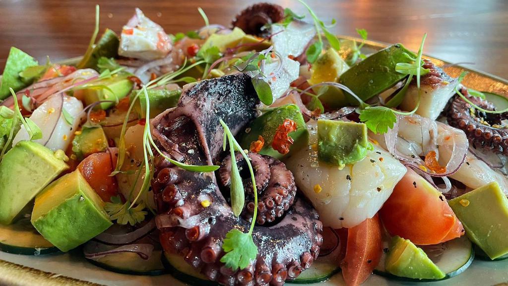 Mariscada · Special fresh chef's selection with scallops, octopus and shrimp seasoned with pepper, chiltepin salt, olive oil and lime juice, topped with red onions, avocado, tomatoes and cucumber.