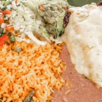 Tampiquena · Beef skirt served with rice, refried beans, enchilada,
lettuce, pico de gallo and guacamole