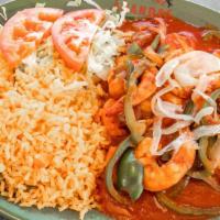 Camarones A La Diabla · Grilled shrimp covered in spicy hot salsa served with rice, lettuce, and tomato.