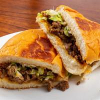 Torta · Your choice of meat served on a Mexican Bun, topped with lettuce, tomato, avocado and sour c...