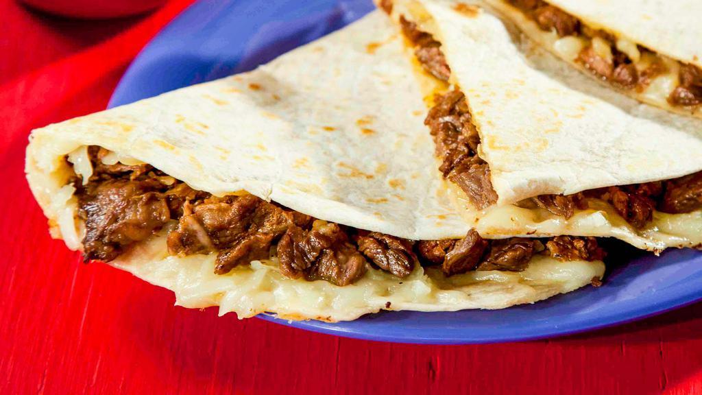 Quesadilla Meat (Large) · A corn or flour tortilla filled with melted white cheese and your choice of meat.