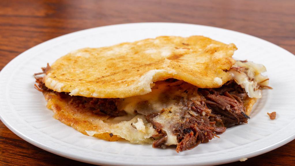 Gordita · Served with refried beans, cheese and your choice of meat.