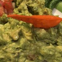 Guacamole · Fresh avocado mixed with tomatoes, onions, and fresh squeezed lime juice.