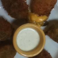 Jalapeños Rellenos · Jalapeños filled with monterey jack and cheddar cheese and deep fried. Served with ranch dre...