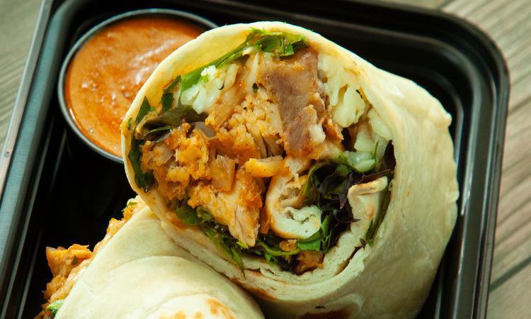 Wrap - Butter Sauce · Made from scratch wraps rolled in our house-prepared naan bread filled with power greens, shredded paneer, and mint yogurt drizzle