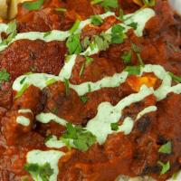 Family - Tikka Masala · Our tikka masala sauce with herbs and spices topped with mint yogurt and cilantro and your c...