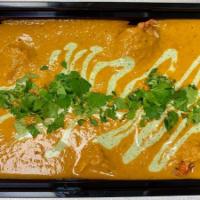 Family - Butter Sauce · Our creamy butter masala sauce with herbs and spices topped with mint yogurt and cilantro an...