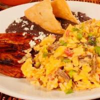 Huevos Aporreados · Two scrambled eggs with cecina, tomato, jalapeño, side black beans. Option fried plantain or...