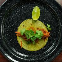 Tinga De Res · Shredded beef, tomato chipotle, chorizo and spices.