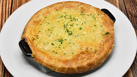 Chicken Pot Pie · Pulled chicken, red potatoes, peas & thyme, topped with a flaky puff pastry. Baked daily.