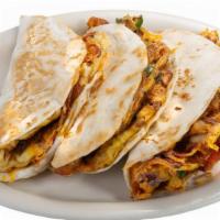 Breakfast Taco · A flavorful combination of egg, potato, cheese, and onion w/ your choice of bacon, sausage o...