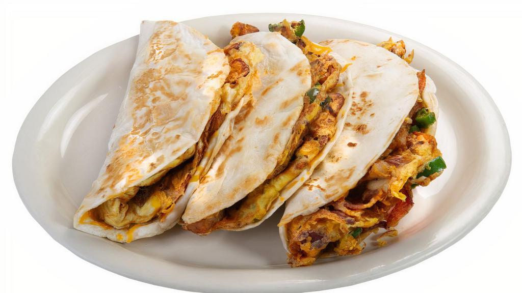 Breakfast Taco · A flavorful combination of egg, potato, cheese, and onion w/ your choice of bacon, sausage or chorizo, in a grilled flour tortilla.
