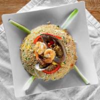 Arroz Chaufa De Mariscos · Fried rice served the Peruvian way overflowing with cooked srimps, tender calamari and musse...