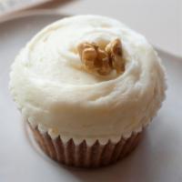 Award Winning Carrot Cake  · Carrot cake topped with a citrus cream cheese frosting and garnished with a gilded walnut. C...