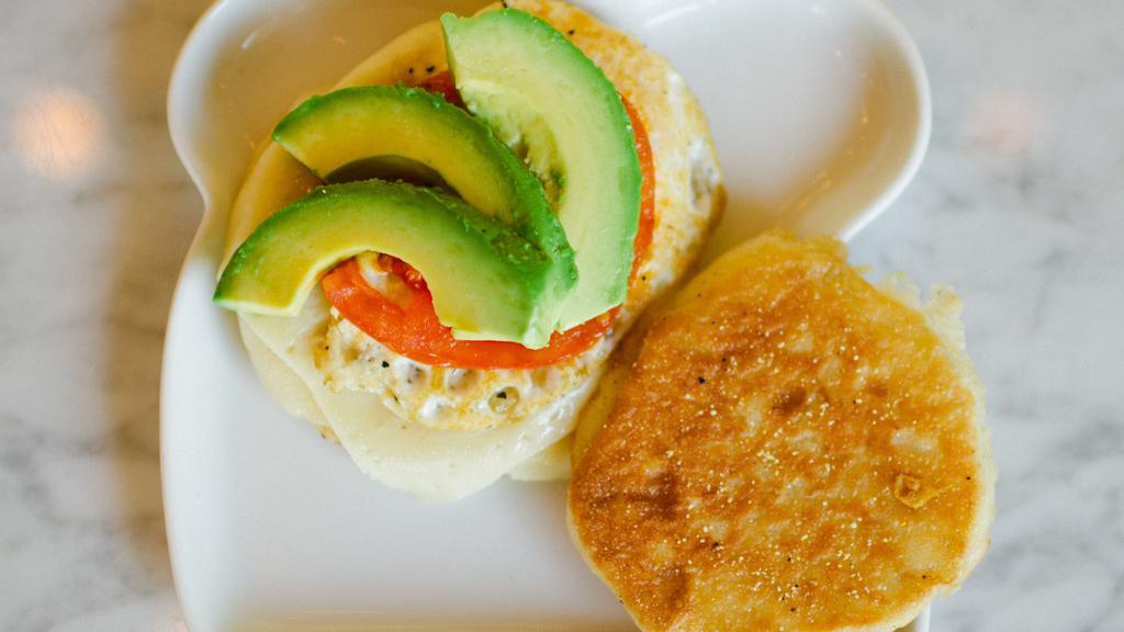 Breakfast Sandwich · Toasted English muffin, havarti, tomato, avocado, egg cooked to preference.