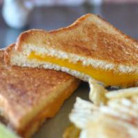 Nostalgic Grilled Cheese · Cheddar cheese toasted on brioche.